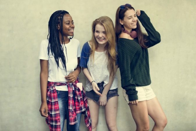 Group of young teenage women laughing