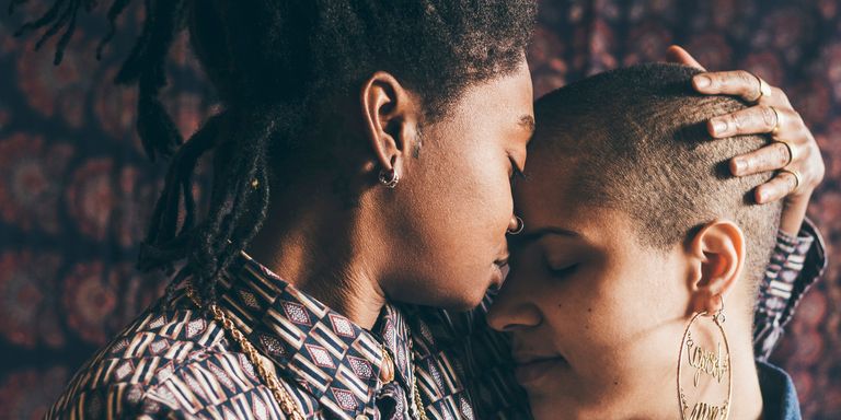 two women of colour embracing