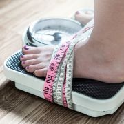 Woman standing on scales